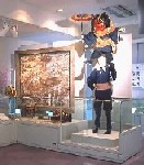 傘を持った獅子舞が肩に乗った姿の模型が飾られてある梛八幡神社獅子舞の写真